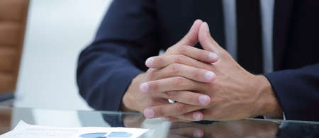 closeup.business man sitting behind a Desk.business conceptの写真素材