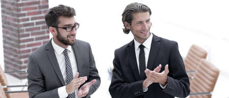 business partners applauding ,standing in the office