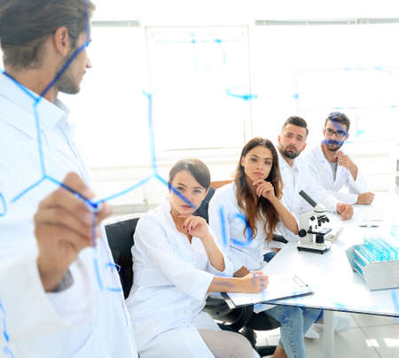 view through the transparent Board. a scientist makes a report.の写真素材