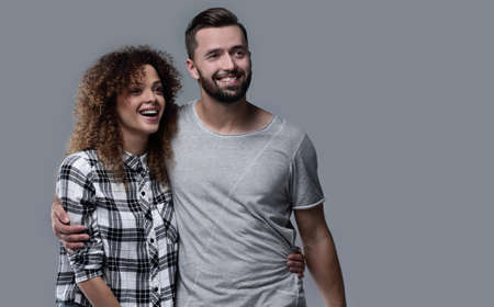 young couple discussing their dreams and pointing forward.の写真素材