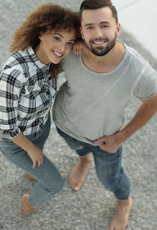Top view modern young couple standing in new living roomの写真素材