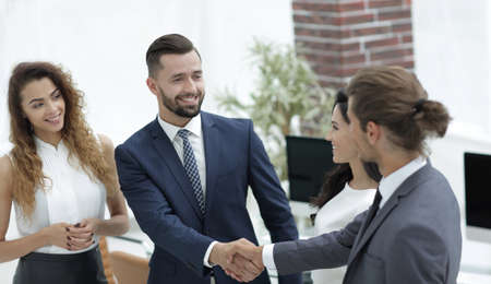 handshake business partners in the office.の写真素材
