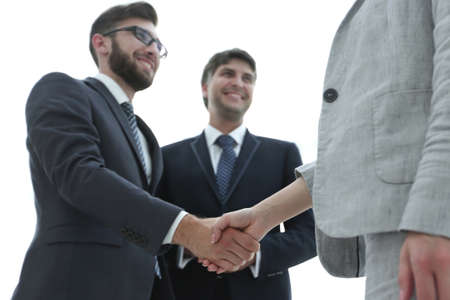 Close-up of business people shaking handsの写真素材