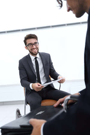 business executives discussing documents and ideas at meetingの写真素材