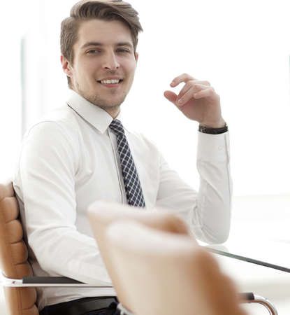 employee sitting in front of a computer screenの写真素材
