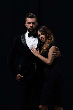 portrait of fashion couple on black background
