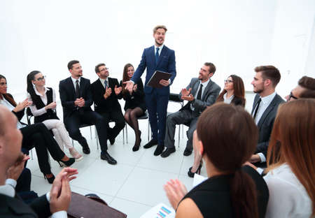 business people applauding the coach after the lecture .の写真素材