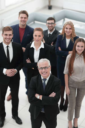 view from the top. group of smiling business people looking at camera.の写真素材