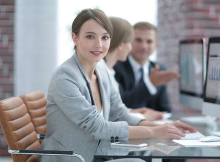 young business woman sitting at the Desk