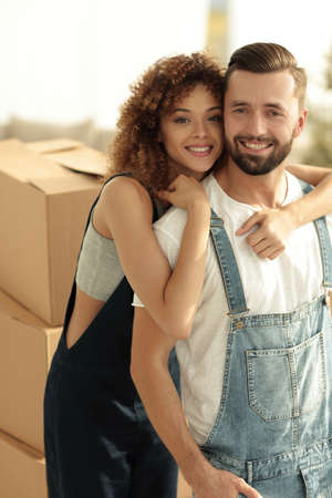 Close-up portrait of a newly-married couple in work clothes