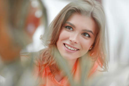 portrait of smiling woman face on blurred background.の写真素材