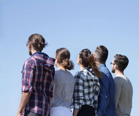 rear view .a group of students looking at copy space.の写真素材