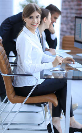 young employee sitting at a Deskの写真素材