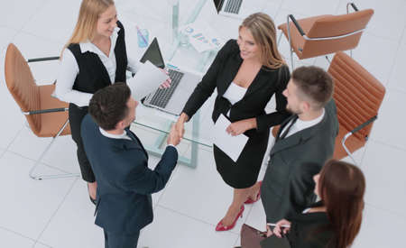 Business partner greeting each other with handshake