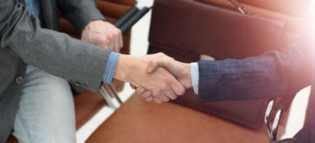 handshake of business partners after discussion of the financialの写真素材