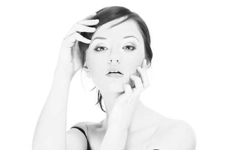 Portrait of a young woman with makeup isolated on whiteの写真素材