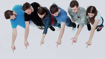 group of young people pointing at somethingの写真素材