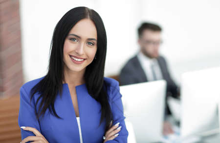 Successful young business woman with charming confident smile