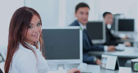 Beautiful young woman looking at camera with smile at the modern