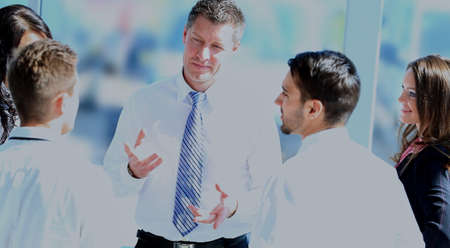 Business people working and discussing together at meeting in office