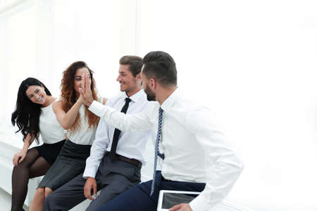 colleagues giving each other high five.の写真素材