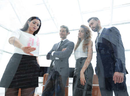 Executive woman talking with her business teamの写真素材