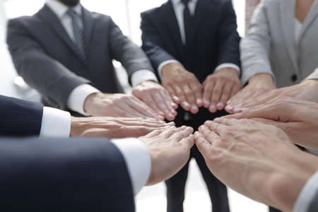 business people giving each other their handsの写真素材