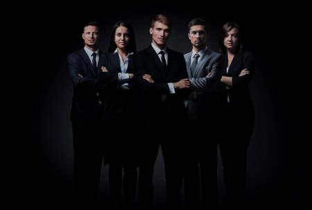 Portrait of five business people standing