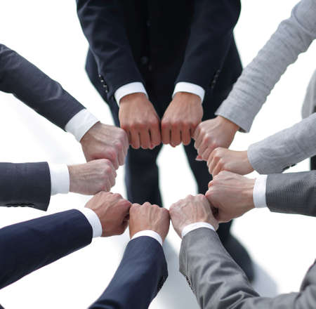 closeup.business people show a circle of hands.