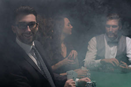 businessman showing four aces