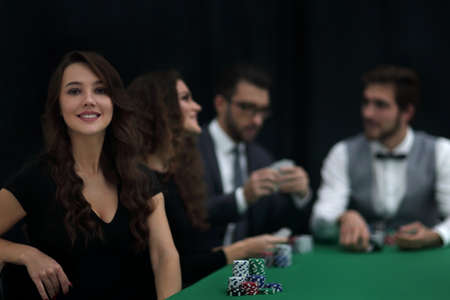 modern business woman sitting at craps table in a casino.の写真素材