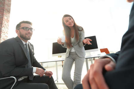 blurred image of business team during a break.