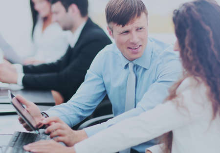 tax consultant is talking with the company accountant in the wor
