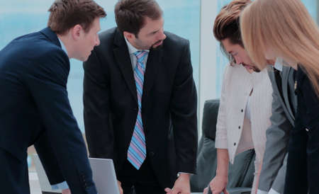 Successful team of coworkers making great meeting discussion in