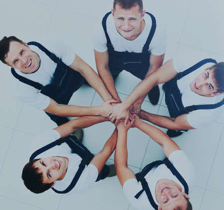 Large group of workers standing in circleの写真素材