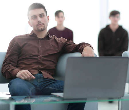 closeup.brooding guy with a laptop