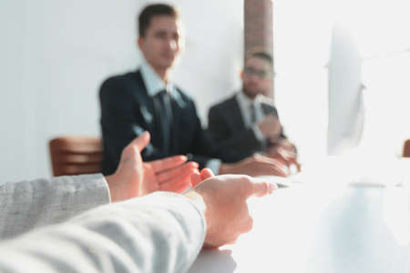 closeup. business team sitting at their Deskの写真素材