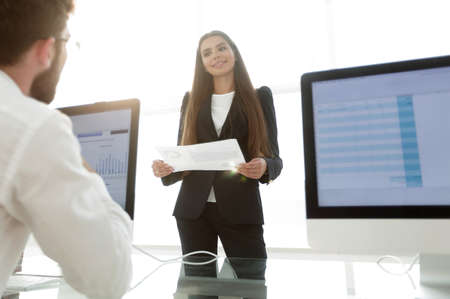 business colleagues discussing documents in the office.の写真素材