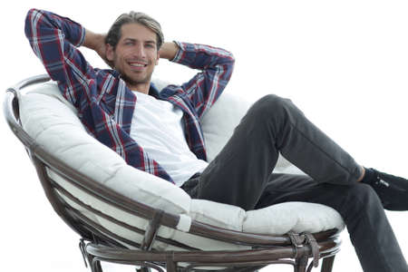 close-up. a successful guy sitting in a large round comfortable chairの写真素材