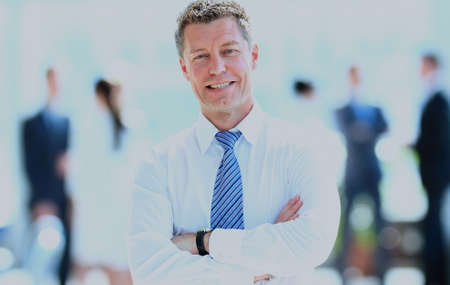 Portrait of happy smiling businessman in a modern office