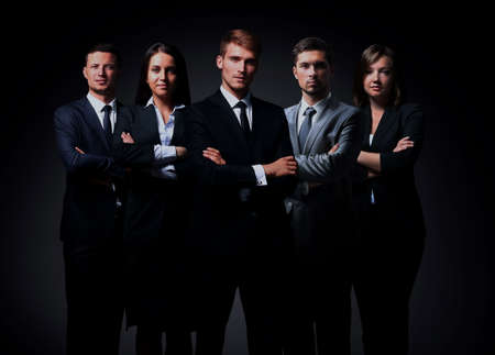 Portrait of five business people standing