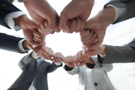 group of people joined their handsの写真素材