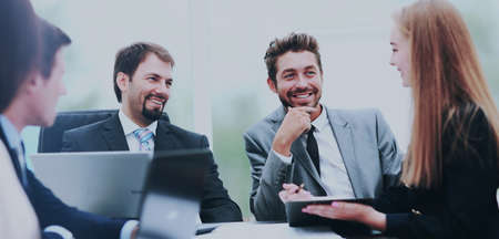 manager discussing work with his colleagues