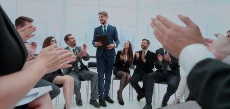 Business group greets leader with clapping and smilingの写真素材