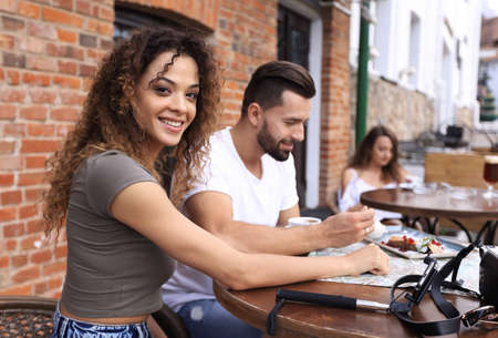 Travelling young people eating healthy food togetherの写真素材