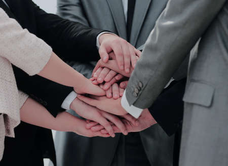 success concept collaboration: a friendly business team put theiの写真素材