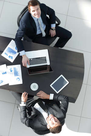 view from the top.business partners discussing the terms of a financial contractの写真素材