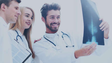 A group of doctors examining an x-ray in the hospital