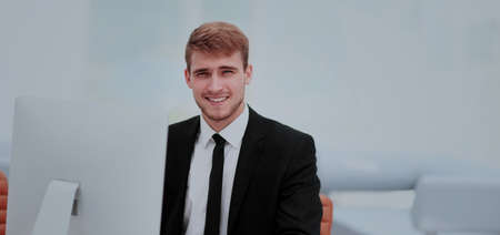 Portrait of happy businessman  at the workplace