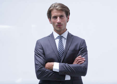 thoughtful businessman adjusting his tie.